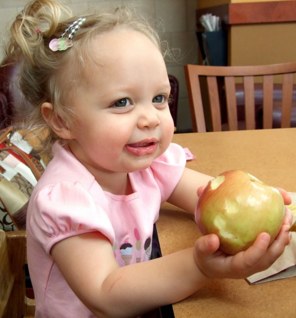 Emma Kate eating apple