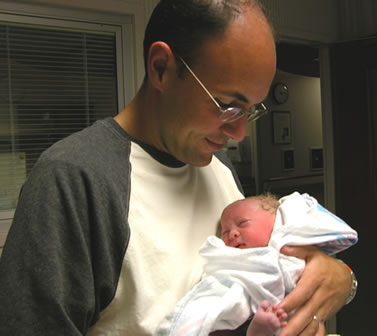 Being held by dad for the 1st time